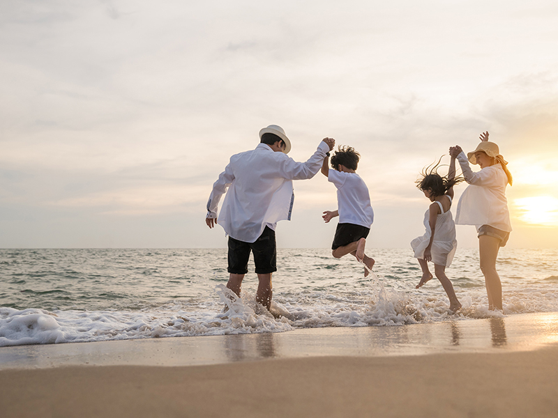 family enjoying the beach
