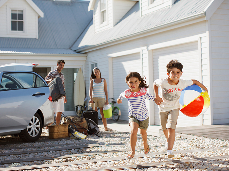 young family going to the beach