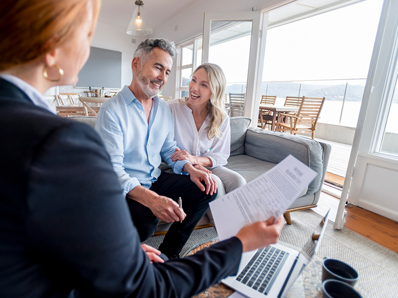 couple talking to realtor
